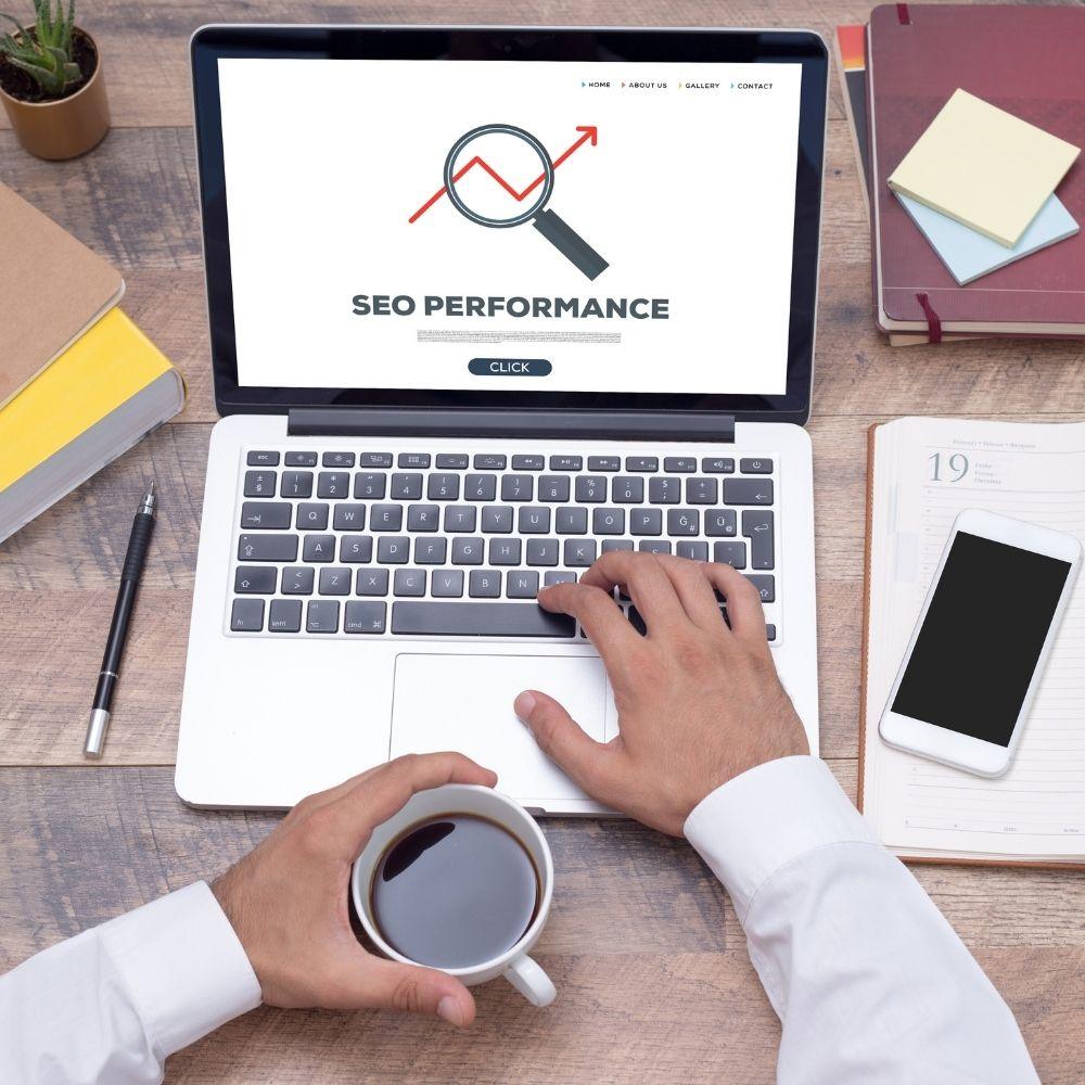 Person analyzing search engine results on a laptop, symbolizing SEO research.